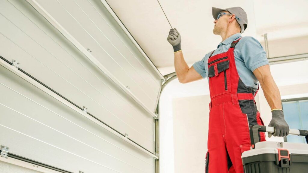 man working on garage door 