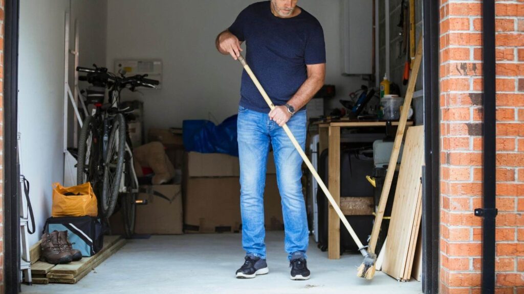 man cleaning garage